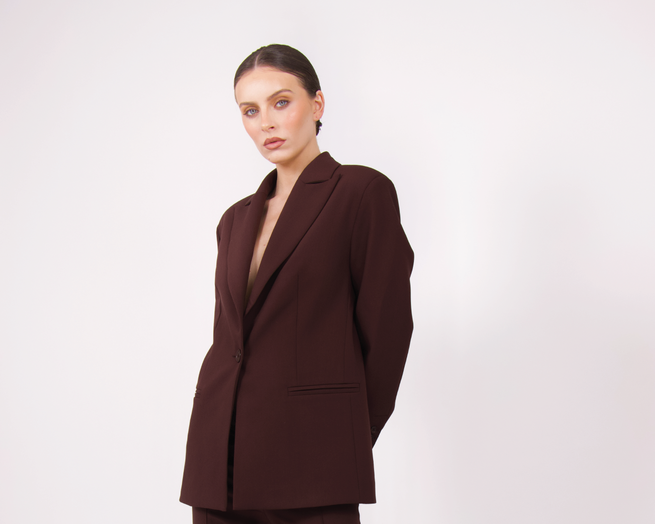 A model wearing BOLDNSUBTLE's oversized brown blazer, styled for effortless layering and timeless dressing.