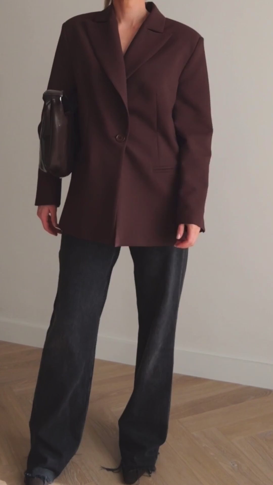 Close-up of BOLDNSUBTLE's brown oversized blazer, featuring a relaxed yet structured fit with sharp lapels.