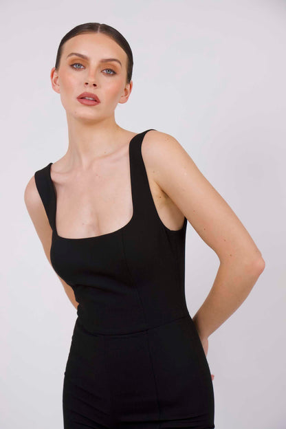 BOLDNSUBTLE black fitted jumpsuit – structured minimalist tailoring with a shaped neckline and low-back design. A capsule wardrobe essential.